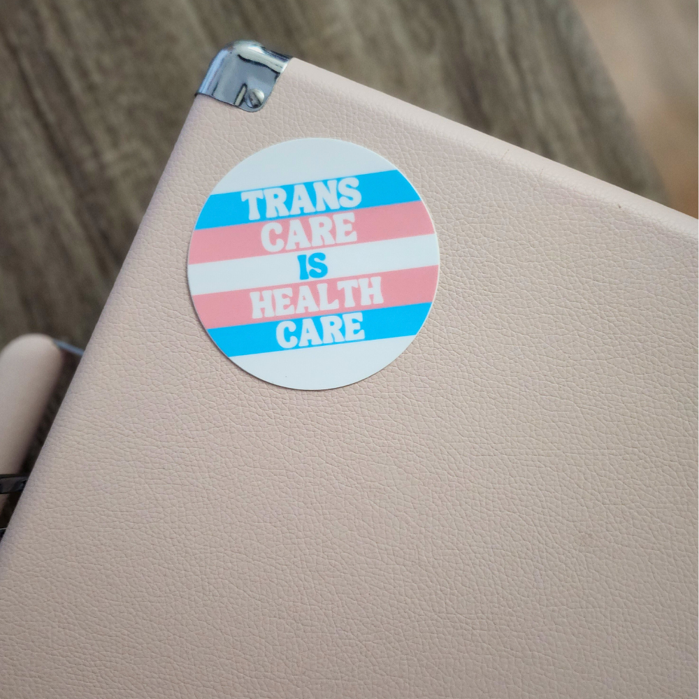 Trans Care is Health Care Sticker Modeled on Laptop