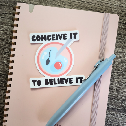 Conceive it to Believe It Sticker Modeled on Notebook