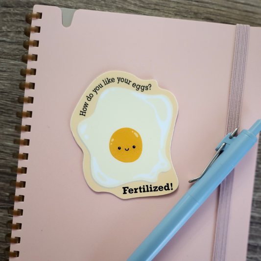 How Do You Like Your Eggs Sticker Modeled on Notebook