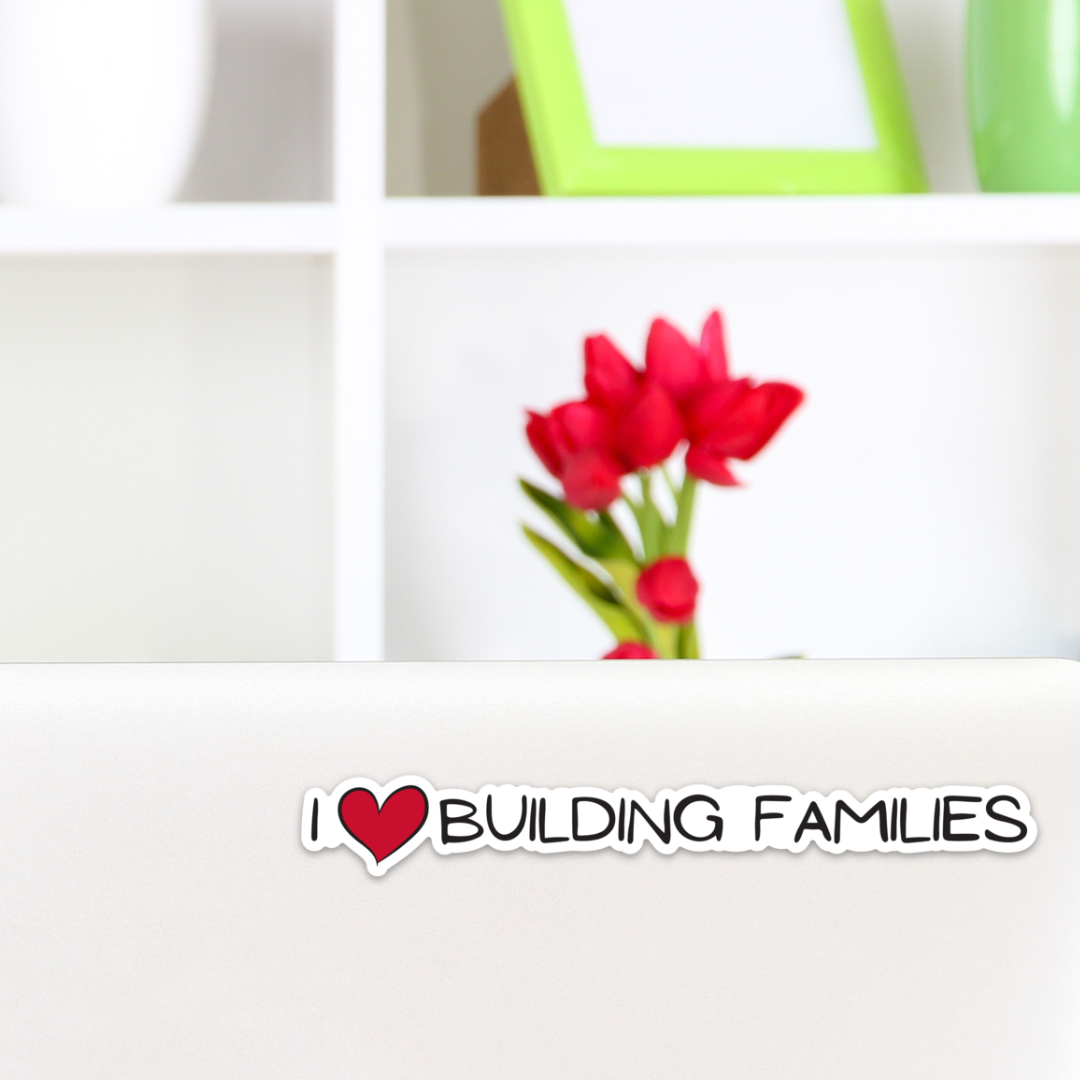 I ❤ Building Families Vinyl 5.47” x .75” Sticker Shown in Context on Laptop