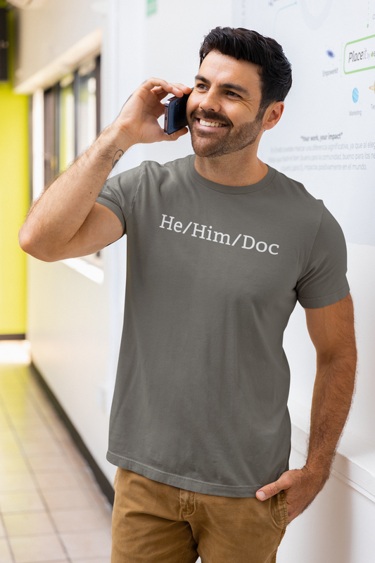 He/Him/Doc Unisex T-Shirt Modeled in Army