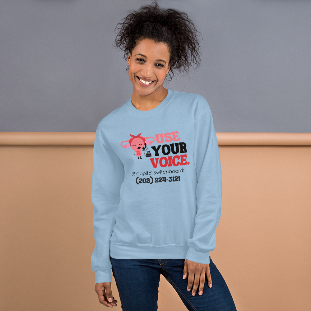 Use Your Voice Reproductive Rights Sweatshirt Modeled on Woman in Light Blue