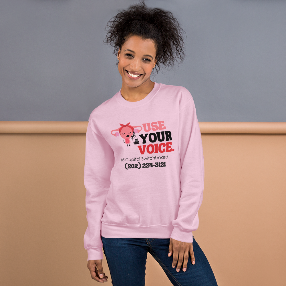 Use Your Voice Reproductive Rights Sweatshirt Modeled on Woman in Light Pink